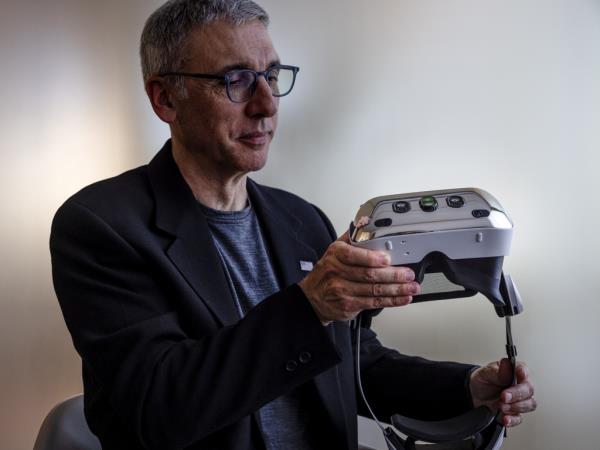 Javier Castellar, the co-founder of Aechelon Technologies, holding a Varjo XR headset