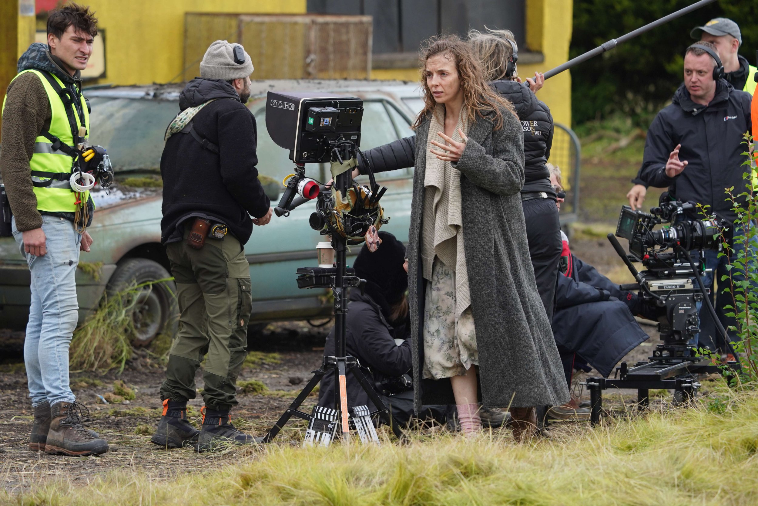 Picture of Jodi Comer on set with camera in between her and a crew member